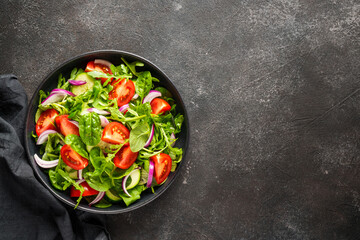 Fresh salad with leaves and vegetables.