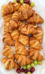 A table full of breakfast croissants