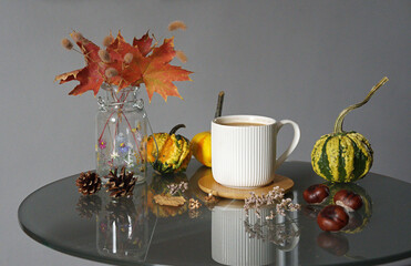 A fall-themed arrangement featuring a cup of Pumpkin Spice Latte.