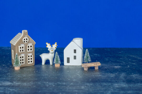A small white house with a deer in front of it - Powered by Adobe