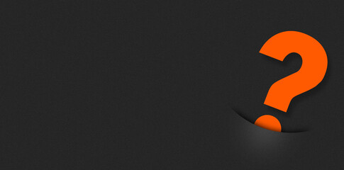 Question mark concept. Orange question mark coming out of a pocket on a black background.