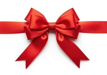 Vibrant red silk ribbon bow tied on a white surface for gifts and decorations