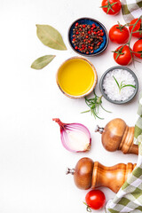 Eat healthy, cook delicious. Food background, spices, basil, rosemary, tomato - ingredients for healthy eating and cooking, white copy space, top view