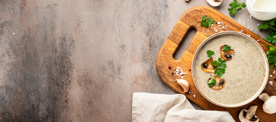 Mushroom soup puree on white kitchen table.