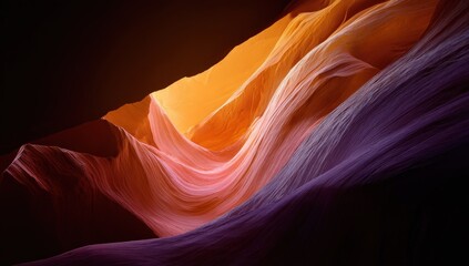 Obraz premium Wavy sandstone formations, colored by light, create a surreal landscape in shades of orange and purple