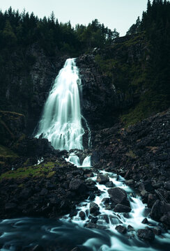 l&aring;tefossen Lattefossen waterfall in norway during rainday cold waterflow river long exposure
