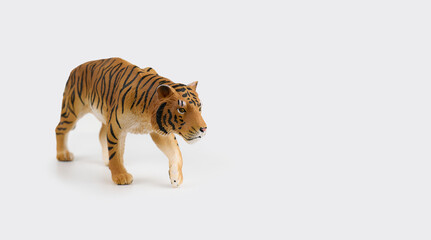 Toy tiger figure on a white background