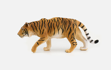 Toy tiger figure on a white background