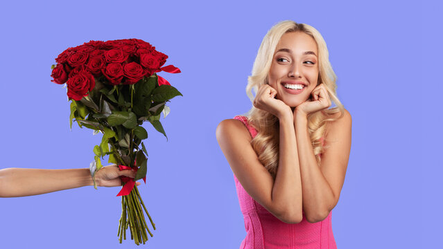 Present Concept. Portrait of cute smiling stylish blonde lady looking at bunch of flowers, hand holding bouquet of red rosed and giving to excited woman , blue studio background, banner. Fast Delivery