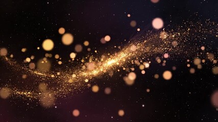 Magical shimmering golden particles and bokeh lights flowing on a dark cosmic background