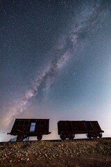 Milky Way Over the Historic Turkish Railway Line in Israel &ndash; World War I Ottoman Military Route to the Suez Canal, Now a Preserved Site with Vintage Rail Cars