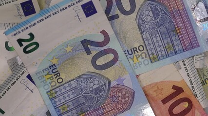European currency with twenty, ten, and five euro bills rotating in a loop for financial concepts - Powered by Adobe