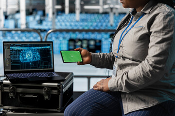 Close up of data center admin using green screen smartphone and reviewing AI code. Server hub IT specialist using chroma key phone, running artificial intelligence assisted diagnostics on gear