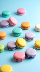 Colorful macarons on a light blue surface