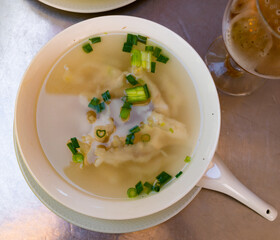 National dish of Chinese cuisine soup albondigas - soup with fish meatballs, potatoes, carrots,...