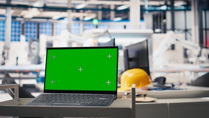 Green screen display on computer used to help in photovoltaics factory system parameters. Chroma key mockup pc used for optimizing energy supply in solar panel manufacturing plant, eco friendly.