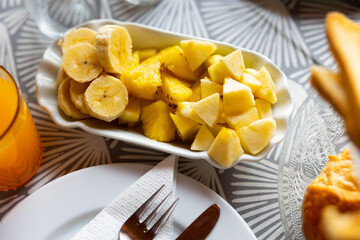 Pieces of juicy fresh tropical fruits served on platter