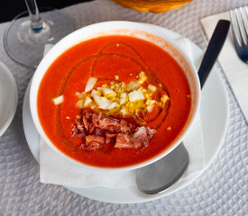 Cordoban salmorejo with ham and egg shavings is a traditional Spanish cold tomato soup.