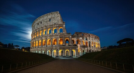 Fototapeta premium Historic Roman Colosseum illuminated at night under a full moon