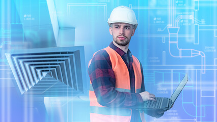 Engineer in hard hat and safety vest using laptop for HVAC system inspection, ventilation ducts and technical blueprints in background. HVAC engineering.