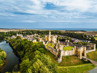 Obraz premium Warkworth Castle over River Coquet from a drone, Warkworth, Northumberland, England