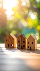 Wooden houses on a table, sunny bokeh