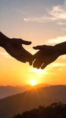 Hands reaching at sunset