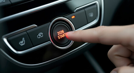 Pressing the illuminated engine start stop button to power the car ignition system