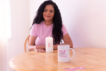 Hands holding pink ribbon representing hope and breast cancer support