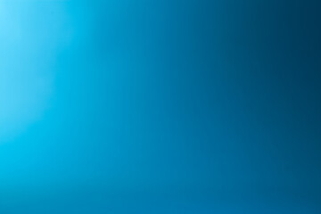 blue gradient background with some smooth lines in it and some light effects