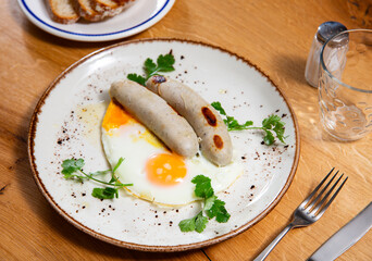 Delicious hearty breakfast with scrambled eggs and sausage