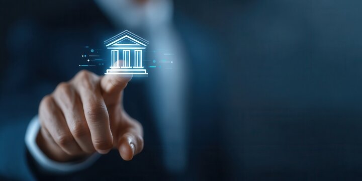 Professional Man Points at Digital Bank Icon on Blurred Background in an Office Setting