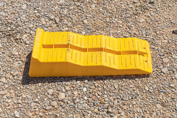 Yellow leveling block on the brown soil