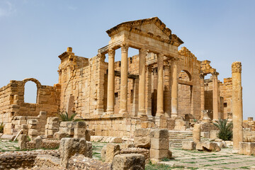 Ruins of ancient Roman capitol forum on territory of antic city of Sufetula in area of modern Tunisia. Half-destroyed buildings from time of Roman Empire. Roman Forum of Sufetula