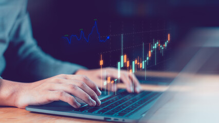 Hands on laptop with rising candlestick chart illustrate financial insight, real-time market analysis, forex and stock trading, investment growth, revenue performance, data-driven wealth management