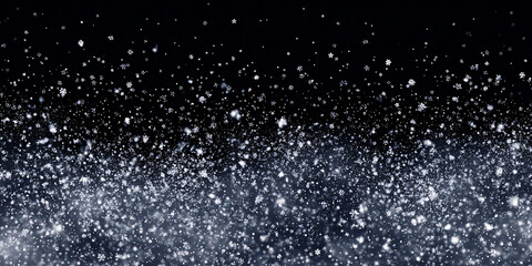 Falling snow particles on a dark background. Abstract winter background. Snowfall on New Year's Eve.