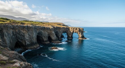 Fototapeta premium Dramatic cliffs and natural arches meet the deep blue sea in menorca, spain