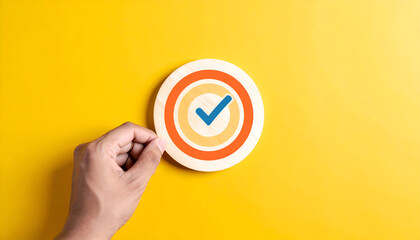 Creative concept showing hand aiming at checkmark in bullseye, representing business success strategy, precision, and leadership focus.