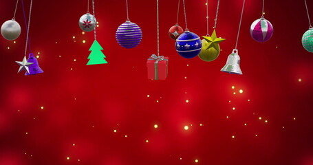 Image of christmas baubles decoration and snow falling on red background