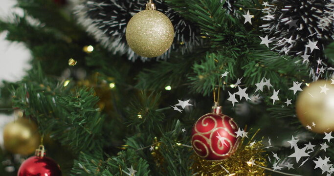 Naklejki Christmas tree with ornaments and twinkling stars image