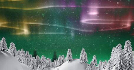 Image of snow falling over norhern lights and winter landscape