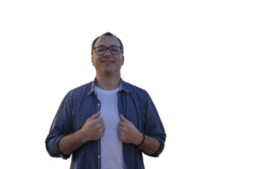 Smiling man wearing glasses on urban city rooftop