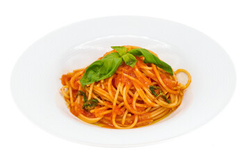 Classic Italian pasta, Spaghetti with tomato sauce and basil on a white plate