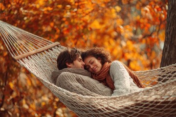 Calm loving duo lounging in a hammock in a fall park