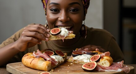 Close-up of person enjoying pizza with figs, prosciutto and burrata cheese on wooden board