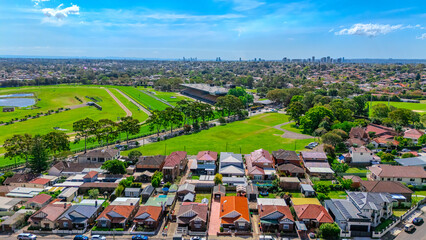 Naklejka premium Aerial Drone view of Sydney Inner West Sydney Suburb of Ashbury and Croydon with house roof tops, the streets parks and cars in Sydney NSW Australia