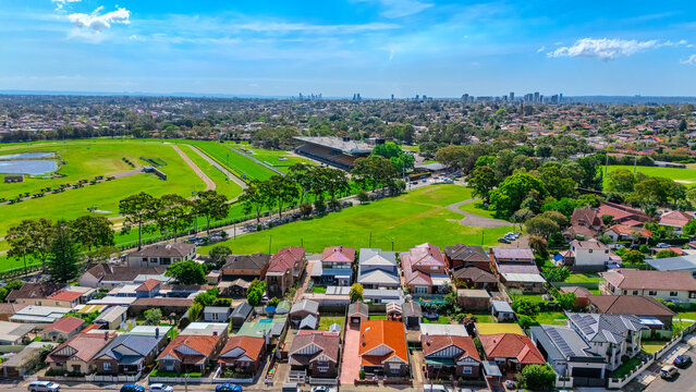 Aerial Drone view of Sydney Inner West Sydney Suburb of Ashbury and Croydon with house roof tops, the streets parks and cars in Sydney NSW Australia