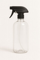 Clear plastic spray bottle with black nozzle isolated on white background – household cleaning product concept.