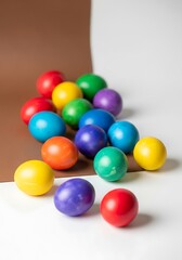 Colorful Easter Eggs on White and Brown Background.