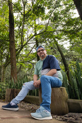 Confident middle-aged man portrait outdoors in natural light